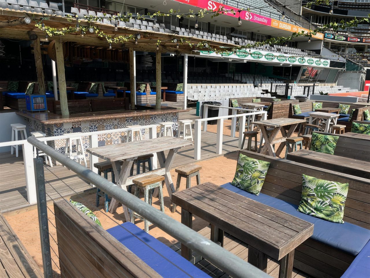 Sand deck and beach seating inside the stadium