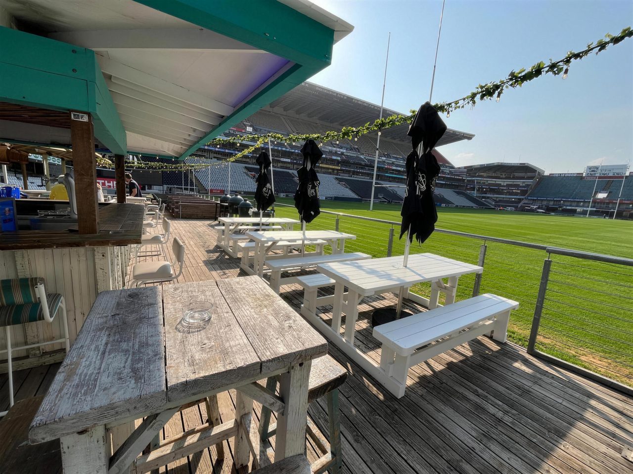 The Deck with teal awning and open pitch view